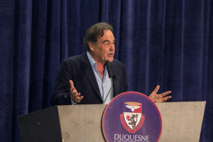 Photo by Aaron Warnick | Photo Editor. Movie director Oliver Stone presents on Friday evening at the Wecht Institute’s JFK symposium. Stone, who directed JFK in 1991, spoke to the audience about Kennedy’s legacy. The 50th anniversary of the assassination is on Nov. 22.