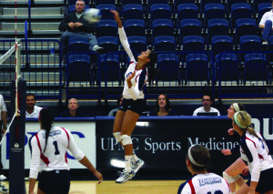 Claire Murray | The Duquesne Duke Marah Farage spikes the ball in Duquesne’s 3-0 victory over George Washington University Friday night at the A.J. Palumbo Center. 