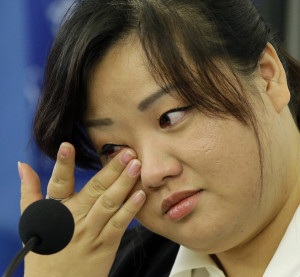 AP Photo. Jin hye Jo wipes a tear on Oct. 30 as she testifies during a hearing of the UN- mandated Commission of Inquiry about the human rights situation in North Korea.