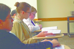 Photo by Claire Murray | Asst. Photo Editor. Students read through the guidelines for projects before the PJAS Competition.