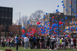 Photo by Richard Kresock | For The Duquesne Duke. Dozens gather Saturday afternoon on Rooney Field to release balloons in memory of Ryan Fleming, who died this January. 