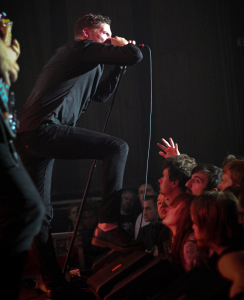Courtesy of Nick Seyler- Vocalist George Clarke of black metal band Deafheaven screams on stage last Thursday at the Rex Theater.