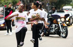 (Claire Murray / Photo Editor) Two young girls walk the parade route Saturday on Liberty Avenue. This year was the 27th African American Day Parade