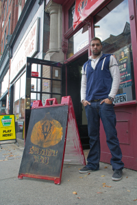 (Zach Brendza / The Duquesne Duke) Spencer Rubeck stands in front of his shop, Innovative Vapors.