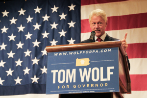Photo by Zach Brendza | Features Editor. Former President Bill Clinton praises Democratic gubernatorial candidate Tom Wolf at a campaign event Monday at the IBEW Union Hall in South Side. Clinton urged voters to unseat Republican incumbent Tom Corbett in the election Nov. 4.