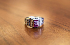 Photo by Claire Murray | Photo Editor. A Duquesne class ring reflects off of a table. The ring, which was created in the early 20th century, is one of the most recognizable rings in the country. 