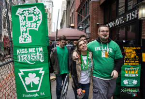 Photo by Claire Murray | Photo Editor. Parade goers walk Downtown on Saturday to celebrate St. Patrick’s Day. Despite wet weather, revelers crowded the parade route, Market Square and South Side. Duquesne and Pittsburgh police increased their patrol numbers to reduce drunken antics.