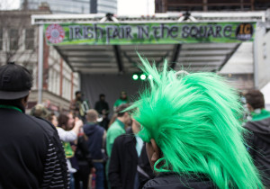 Photo by Claire Murray | Photo Editor. Someone celebrates St. Patrick’s Day by donning a green wig and attending an “Irish Fair in the Square” concert in Market Square after the parade ended.