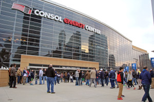 Claire Murray / Photo Editor. Basketball fans mill outside Consol Energy Center March 21 before the Villanova vs. N.C. State NCAA game. Fans brought millions in spending to the city.