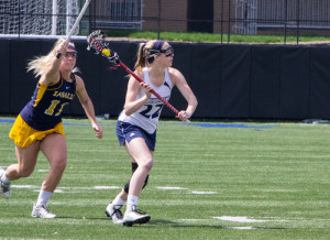 Natalie Fiorilli / The Duquesne Duke Freshman Shae Cowley looks for a teammate in the offensive zone during Sunday’s 10-8 win over La Salle. The Dukes return to action on Friday against George Washington at 4 p.m.