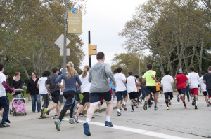 Courtesy of Pittsburgh Donut Run. A swarm of runners take part in last Sunday’s Donut Dash. On top of this physical activity, participants also had to consume donuts mid-race. Proceeds benefit the Live Like Lou Center for ALS Research.