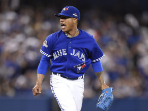 Toronto Blue Jays starting pitcher Marcus Stroman reacts after a pitch against the Kansas City Royals during the sixth inning in Game 3 of baseball's American League Championship Series on Monday, Oct. 19, 2015, in Toronto. (Frank Gunn/The Canadian Press via AP) MANDATORY CREDIT