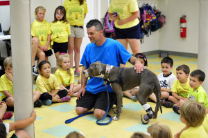 Richard Nash of Castleton, N.Y. with his 3-year-old blue nose pit bull Hudson. After Hudson was adopted from unsavory conditions, Nash and his family had him trained as a therapy dog to visit schools, hospitals, adult day care and hospice centers. Therapy pets of all types can have emotional and mental benefits. 