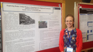 Kayla Casavant | The Duquesne Duke Graduate psychology student Elizabeth Brown stands next to a poster that explains her research project at the 2015-16 Graduate Research Symposium.
