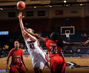 Photo from GoDuquesne. Freshman guard Kadri-Ann Lass goes to the rim for a contested layup in Saturday's win over St. John's. 