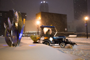 Photo by Seth Culp-Ressler | Features Editor. A utility tractor plows snow at 6:30 a.m. outside the Union during winter storm Jonas on Saturday/