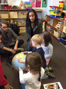 Photo courtesy of Lucia Osa-Melero Duquesne Spanish students show local preschoolers the location of Spanish-speaking countries on a globe as part of a foreign language teaching program.
