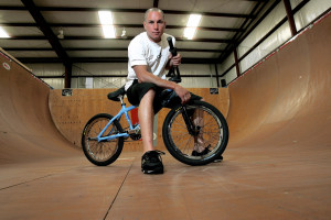 FILE - In a Friday, June 24, 2005 file photo, X-Games athlete Dave Mirra poses in the half-pipe at his training facility in Greenville, N.C. Police say veteran X Games biker Dave Mirra has died in North Carolina. Greenville police said Thursday, Feb. 4, 2016, that Mirra's body was found earlier in the day with an apparently self-inflicted gunshot wound.He was 41.  (AP Photo/Gerry Broome, File)
