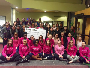 Photo Courtesy of Strong Women Strong Girls The members of Duquesne’s Strong Women Strong Girls chapter pose for a photo  in December 2015 with an oversized check from the Pens4Purpose competition.