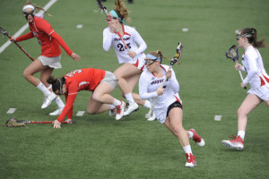 Courtesy of the Athletic Department - Senior attack Lib Lowry carries the ball upfield during a 2015 match last spring. Lowry is currently enrolled in Duquesne’s Education School and has been student teaching when not on the pitch. 