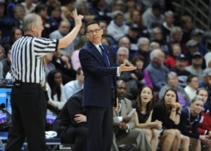 Courtesy of Athletic Department - Women’s basketball head coach Dan Burt argues a call made during the Dukes’ matchup with the UConn Huskies in the second round of the 2016 NCAA Women’s Basketball Tournament. This winter, Burt will return for his fourth year as the team’s bench boss. 