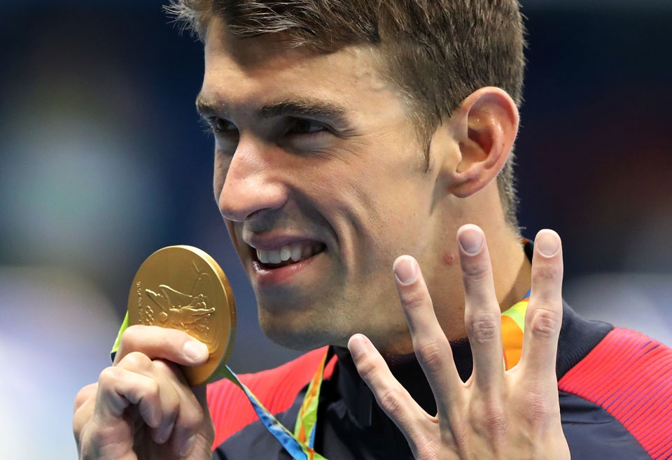 In this Aug. 11, 2016 file photo, United States' Michael Phelps celebrates winning the gold medal in the men's 200-meter individual medley during the swimming competitions at the 2016 Summer Olympics, in Rio de Janeiro, Brazil. (AP Photo/Lee Jin-man, File)
