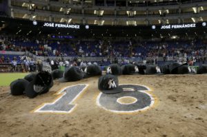 AP Photo | Lynne Sladky Miami Marlins ball caps left by the players sit on the pitching mound with the number 16 in honor of pitcher Jose Fernandez after a baseball game against the New York Mets, Monday, Sept. 26, 2016, in Miami. 