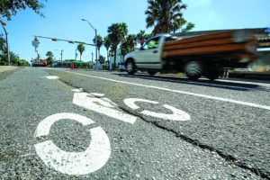 AP Photo Traffic flows along 7th Street, Tuesday, Oct. 4, 2016, in Brownsville, Texas. Traffic flow has been reduced to two lanes as city crews install a new bike path along the downtown street. (Jason Hoekema/The Brownsville Herald via AP)