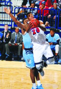 Courtesy of Duquesne Athletics  Sophomore forward Nakye Sanders drives to the basket in a blowout loss to the URI Rams on Jan. 21 at the A.J. Palumbo Center. 