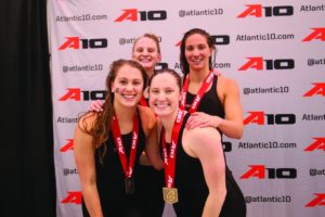 Courtesy of the Atlantic 10 Conference | The Duquesne 400-yard freestyle relay team of Lauren Devorace (front left), Carson Gross (back left), Molly O’Brien (front right) and Lexi Santer (back right) pose after their medal-winning swim at A-10s.