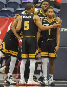 Courtesy of Duquesne Athletics | Mike Lewis II (front right), Isiaha Mike (back right), Emile Blackman Jr. (front center) and Tarin Smith (back left) huddle up and look on in disappointment as they watched a double-digit lead slip away against SJU. 